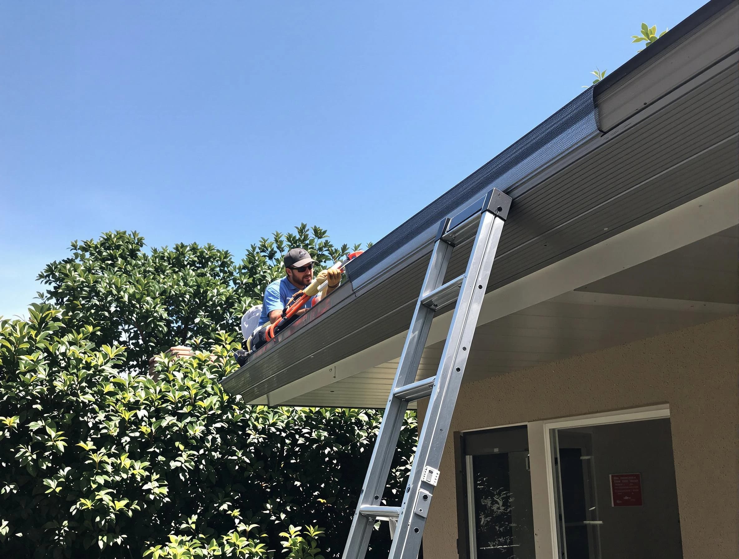 Brook Park Roofing Company installing gutter guards for a homeowner in Brook Park, OH